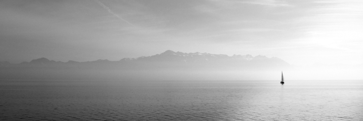 a sailboat on a lake, photo by unsplash